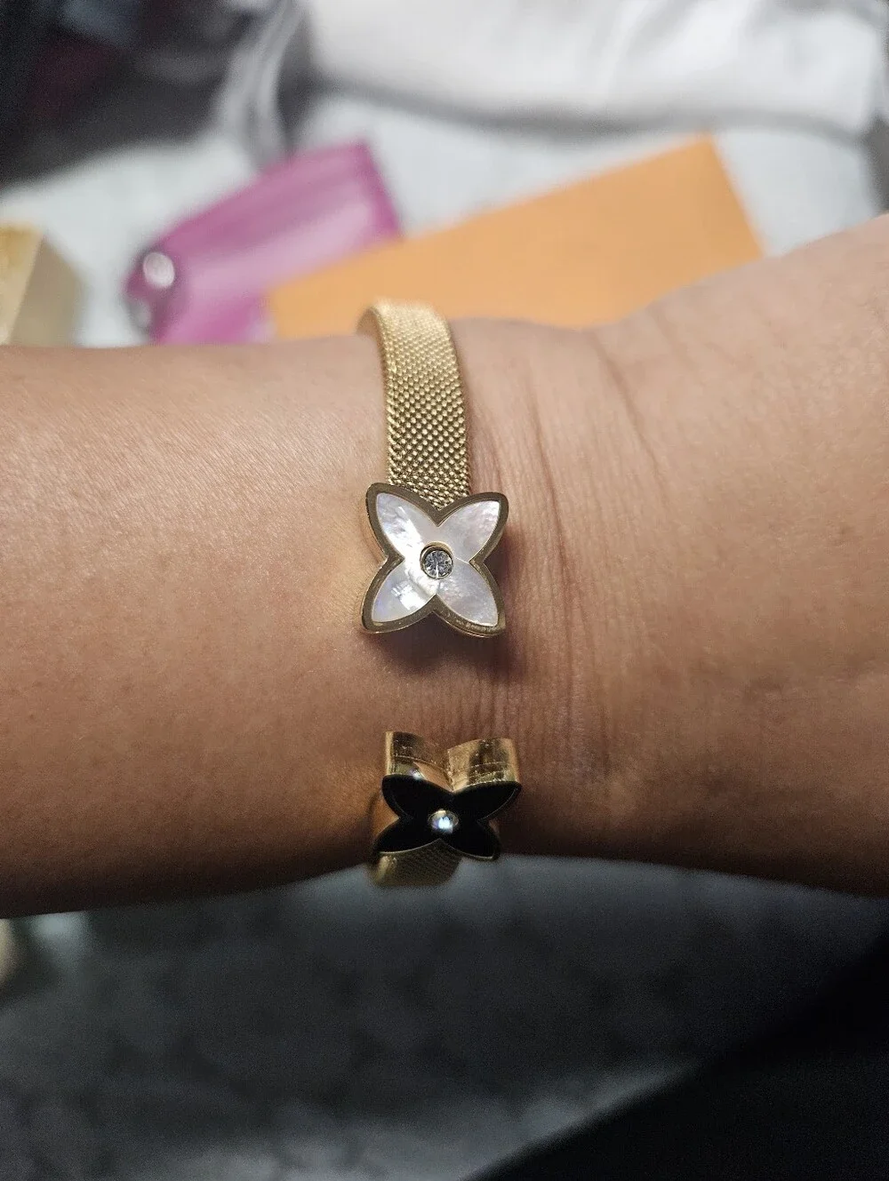 Gold Mesh Bracelet with Black and White Flower Charms